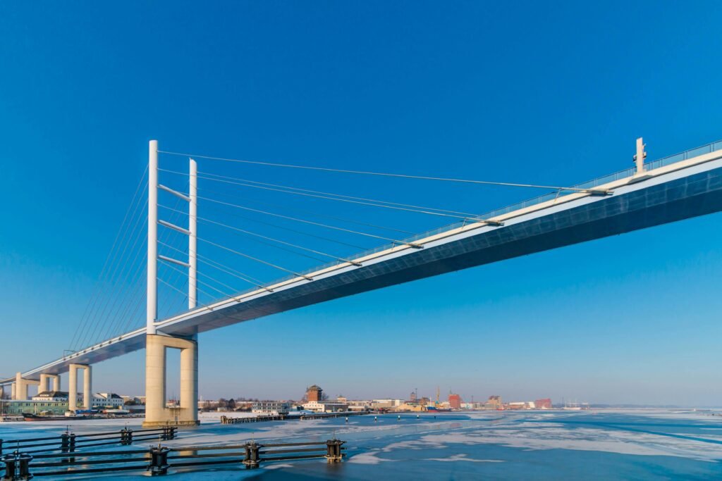 Beautiful Rügen Bridge over frozen water on a clear winter day in Stralsund, Germany.